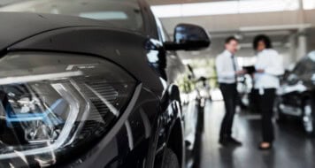 woman enjoying her financially independence while buying car